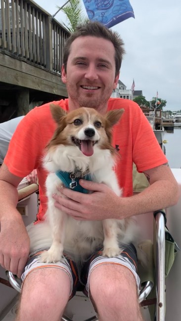 Matt and Bailey taking a morning boat ride at the shore.