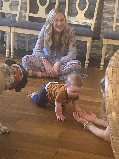 Our friends' baby learning how to crawl at our house with Otis as a helper