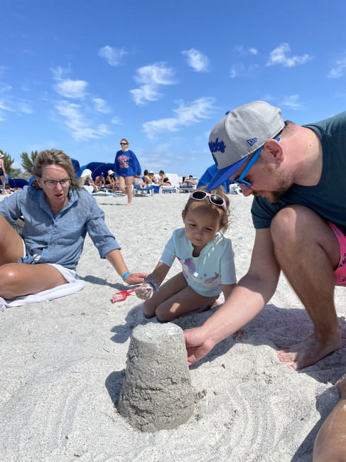 John helping our niece with her sandcastle masterpiece.