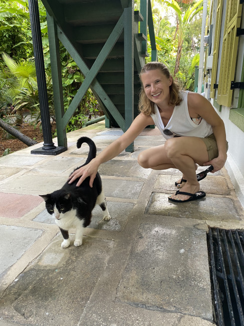 Steph cheating on Graham with a cat at the Ernest Hemingway house in Key West. 