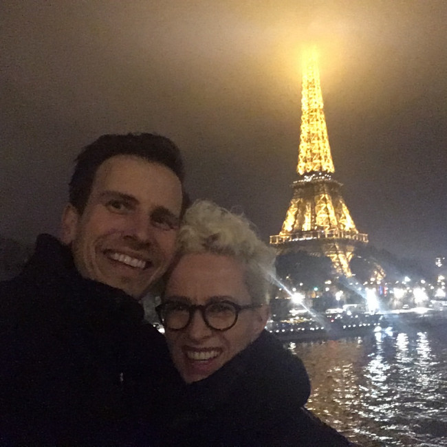 In front of the Eiffel Tower on a cold night in Paris