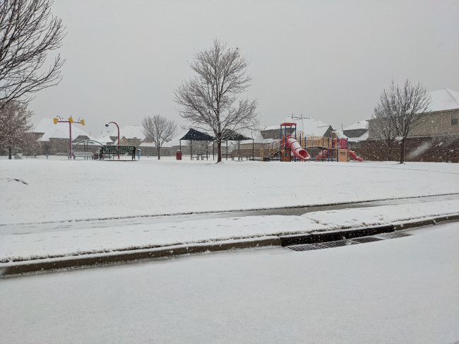 Our neighborhood park, in the snow. We live right across the street and there is even a splash pad for when it is warm! 