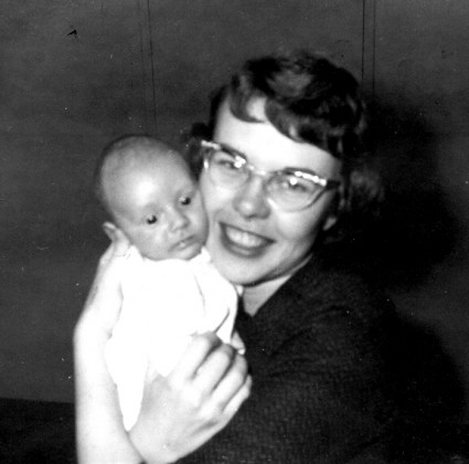 A mother holds her newly adopted baby.