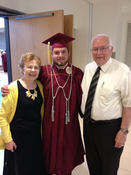 Our grandson Richard with  his grandparents at high school graduation