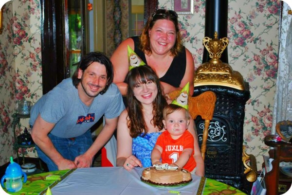 My birth son, his parents, and myself at his first birthday party that I held for him.