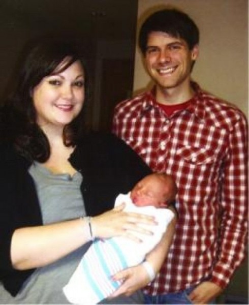 This was our first photo as a family, still in the hospital room where our son was born, just after papers had been signed.  I'm still surprised we were even able to smile.  