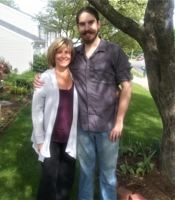 Amy's Mom and Brother posing for a pic in the front yard.