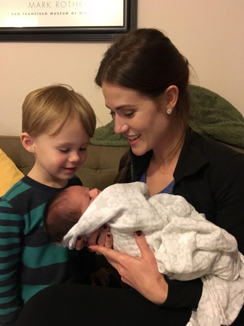 Rachel is showing her nephew his newest little sister. 