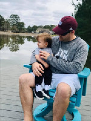 Mark and our nephew relaxing at one of the lakes in our neighborhood