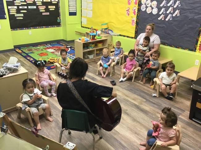 A music lesson in Finn's daycare class.  The daycare is located in the building where we live.  