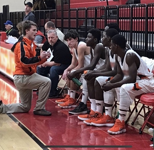Brett coaching his players in the playoffs. Did we mention we LOVE basketball? We both grew up playing and now he gets to coach High School. 