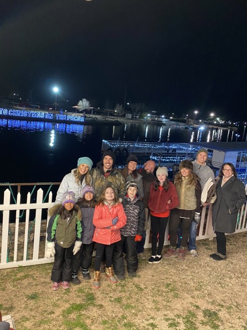 Enjoying Christmas lights on the river with some of our church fam