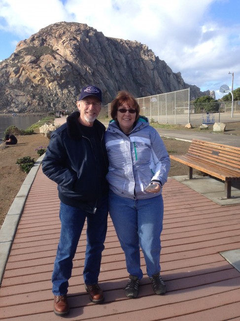 Laura's parents pose in front of Morro Rock.
