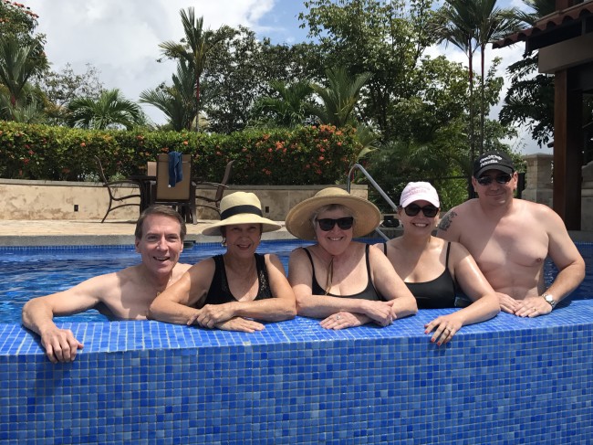 Clay's uncle, mother, family member, sister, and brother-in-law enjoy a day at the pool.
