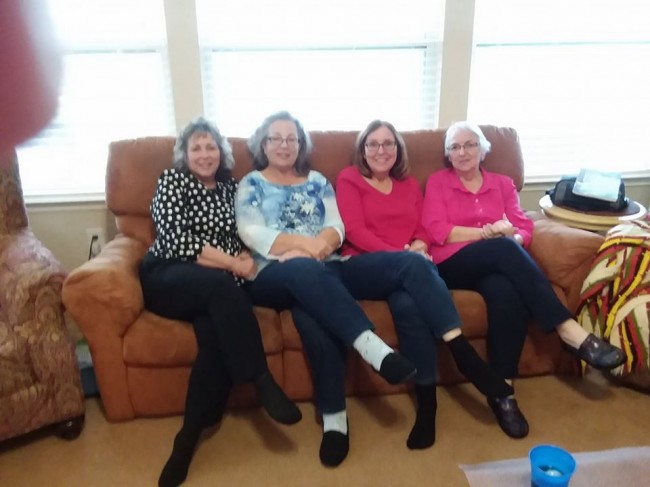 Laura's mother poses with her three sisters at a family gathering.