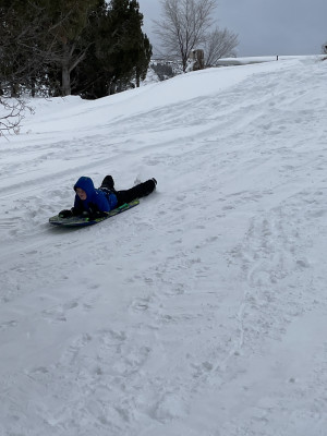Sledding is something fun to bundle up for in the cold winters.