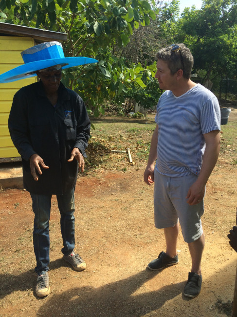 Rhy talking to the gardner of the school in Jamaica