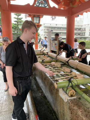We all like to learn through immersive cultural experiences so we travel a lot as a family.  Here is Manny in Japan participating in a local tradition at a garden.