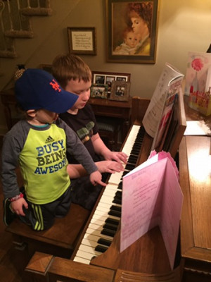 Manny even lets Noah bang on the keys while playing the piano at my mom's house.