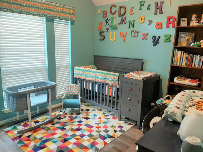 Baby nursery, painted in Laurice’s favorite color. The bookshelf in the corner was build by Jarrett’s dad. 