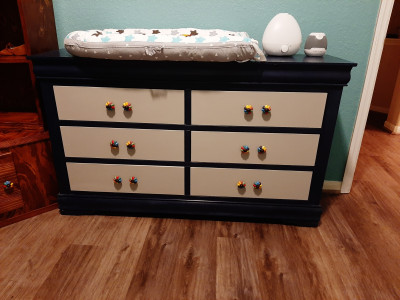 Laurice’s parents helped redo this dresser for the Baby Nursery. We picked the drawer pulls, and picked the colors from that. 