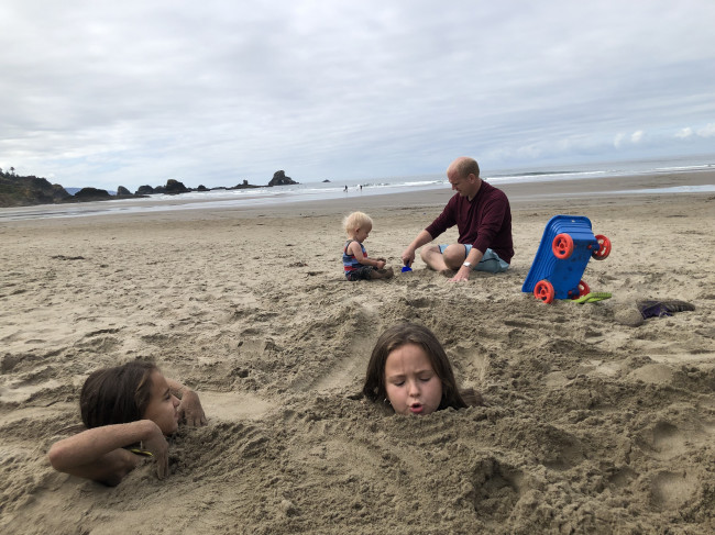 Every beach we go to, the girls want to be buried. 