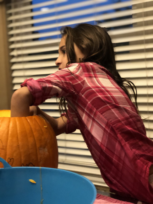 Lily is the most detailed in cleaning out the inside of her pumpkin. 