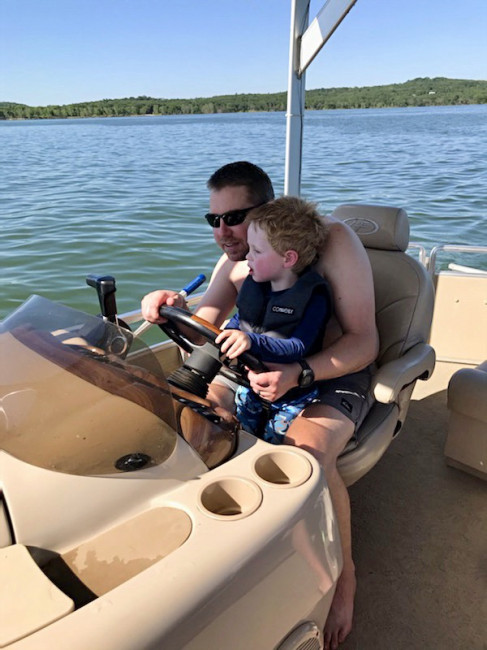 Jason with friend Conner on the lake.