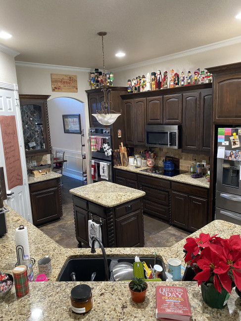 Our kitchen is the heart of our home! We both enjoy cooking, especially together. We love that our kitchen looks onto the living room, dining room, and breakfast area so we can enjoy when we have guests!