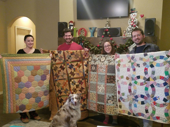 Jake and Monica with his brother and his significant other on Christmas morning when we were each given a handmade quilt by his grandma...of course their pup, Darwin wanted to be included!