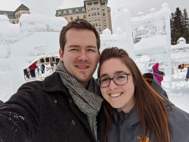 Monica and Jake in Canada in front of an incredible ice sculpture 