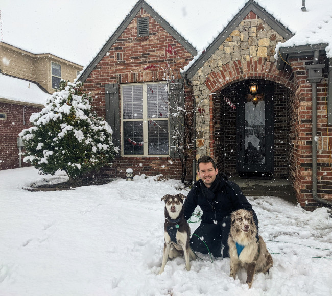 Jake on a snowy morning in front of our house with our pups