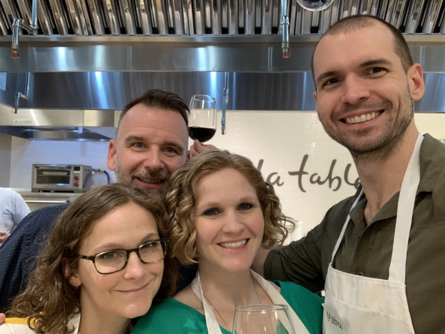 Matt and Ashley with family at a cooking class