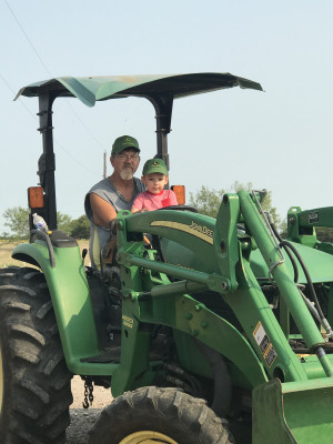 Ian and his Dandan on the tractor. 