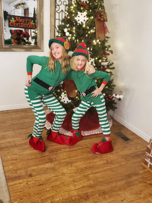 We love to give back to other families at Christmas time. The girls love to dress up like secret elves. 