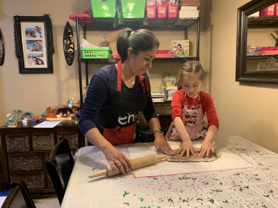 Jacky and our daughter making ginger bread cookies