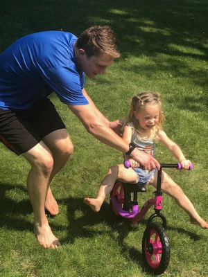 Chase helping Nora learn to ride her bike!