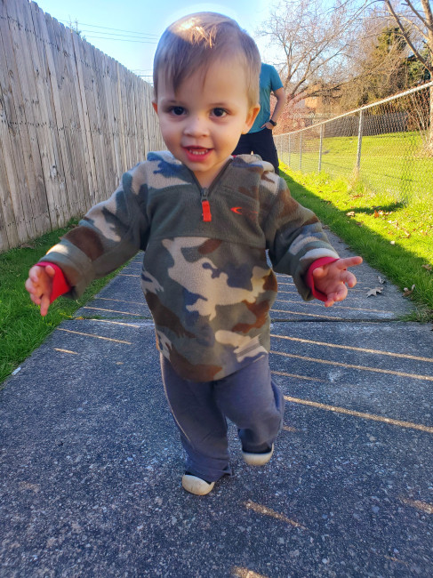 Caleb loves going on walks around the neighborhood 