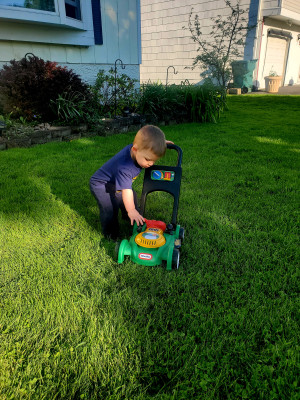 Helping Dad mow the yard 