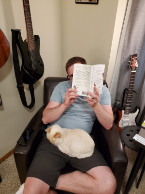 Bill is an avid reader. Sometimes Harvey helps.