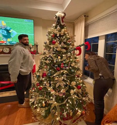 Christmas Eve we tree decorate together at my parents house.  My Nephew Omar and Sister In Law Rita putting on the finishing touches.
