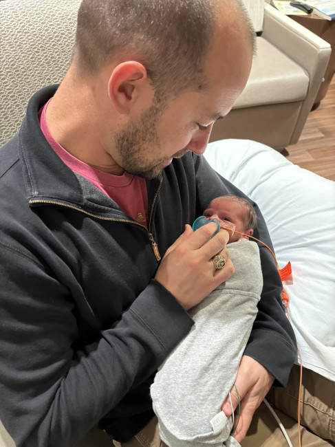 Lee meeting Juliana for the first time in the NICU.