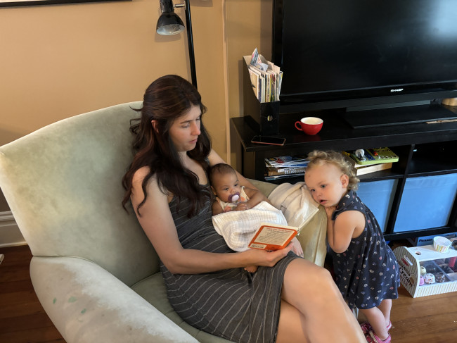 Reading with our aunt and cousin.