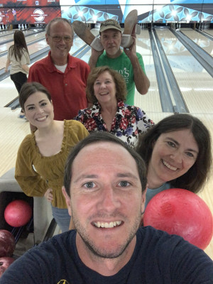 Enjoying a family bowling night with both sets of parents.