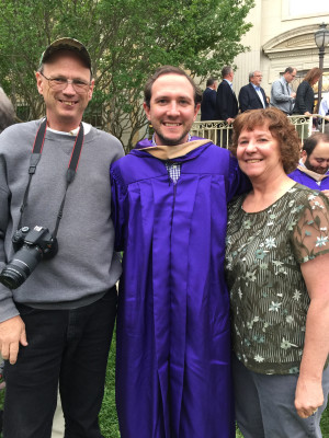Calen with his parents, Chris and Sandie, at his MBA graduation.