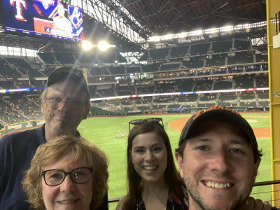 Enjoying a baseball game with Calen's parents.