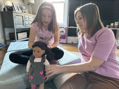 Playing dolls with Nora, Megan's best friend's 9-year-old daughter.