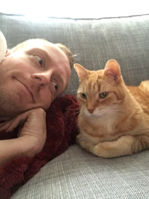 Sharing a goofy moment with our first cat, Alastor