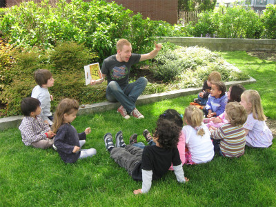 Mike reading to his preschool students in New York City