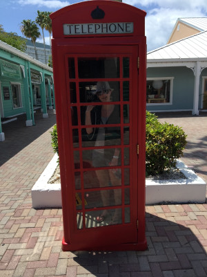 Stacy making a call in an old phone booth in St. Martin.